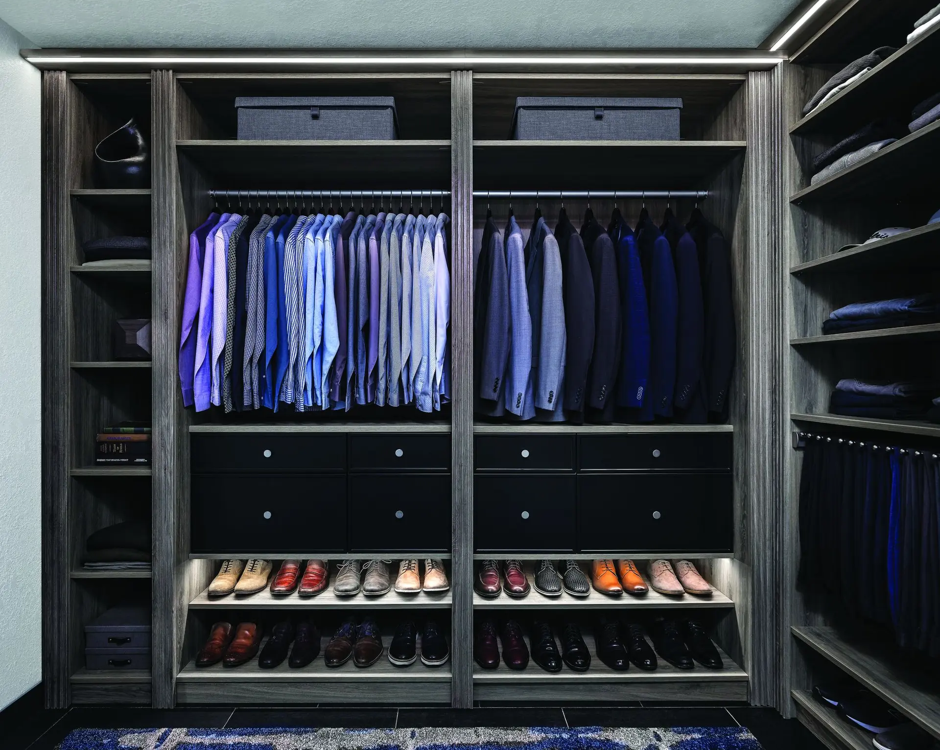 Custom walk-in closet with hanging clothes, shelves and drawers